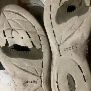 The soles of these pacer Crocs wore right through